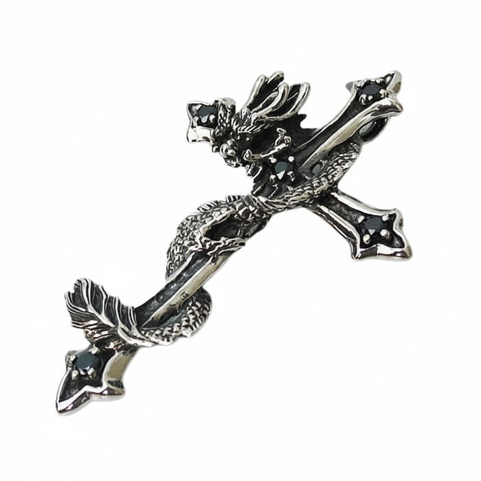An angled view of the dragon cross pendant, highlighting the black CZ stones.