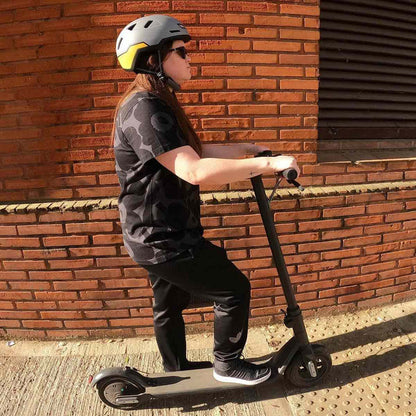 person on scooter wearing gull color xnito helmet