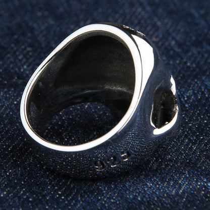 Inverted view of the handcrafted silver skull ring displaying its smooth polished interior and deep hollow back construction.