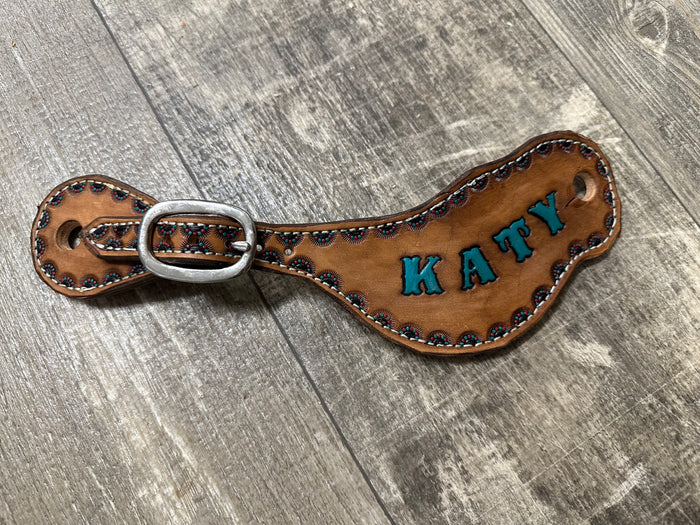 Hand tooled and painted spur straps