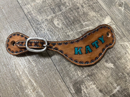 Hand tooled and painted spur straps