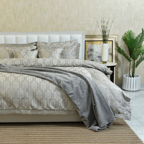 Charcoal gray duvet cover set with geometric damask design and layered coordinating shams