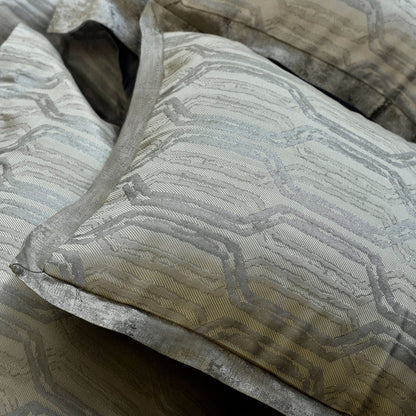 Close-up: charcoal gray duvet cover with embossed geometric texture and stitched edge