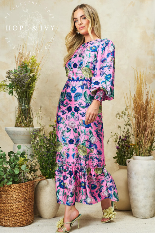 Romantic pink maxi dress by Hope & Ivy with high neck, blouson sleeves and bow back detail. Shop Hope & Ivy Dresses at Dotique.