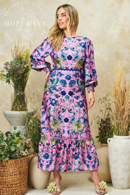Romantic pink maxi dress by Hope & Ivy with high neck, blouson sleeves and bow back detail. Shop Hope & Ivy Dresses at Dotique.