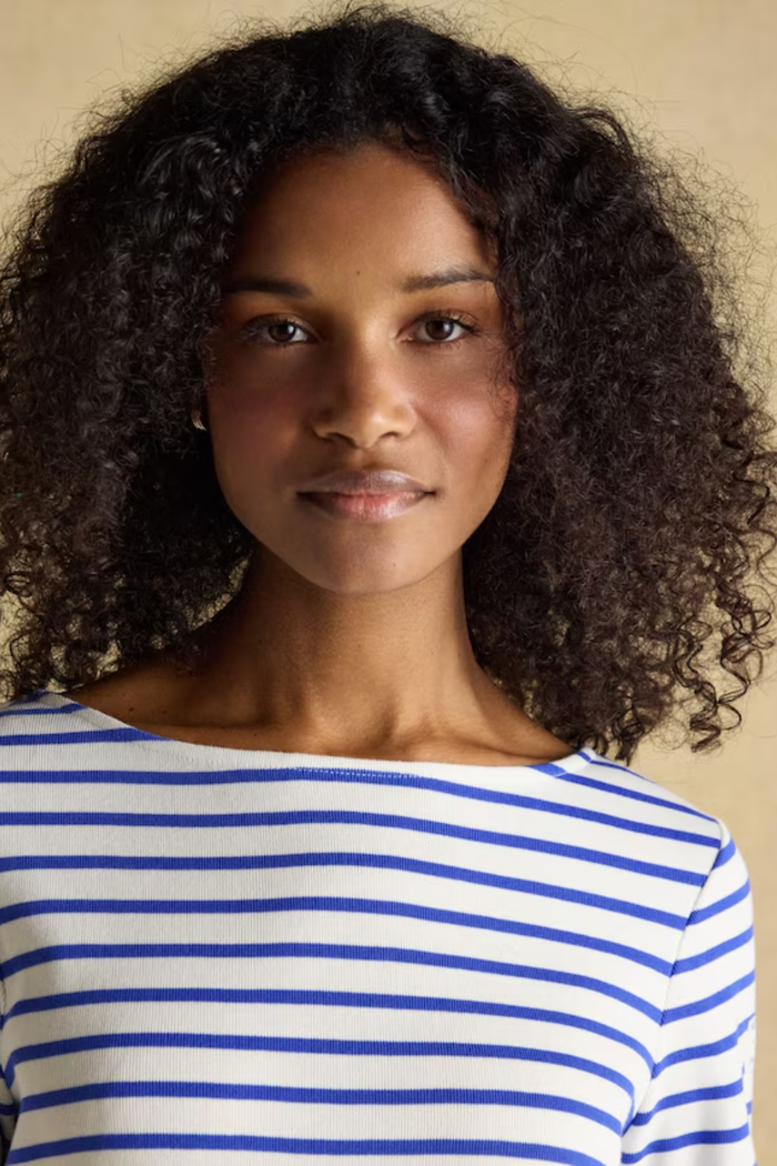 Shop the Joules Harbour blue and white stripe boat neck top — a heritage-inspired relaxed fit in soft cotton jersey, perfect for everyday styling with dresses, jeans or chinos.