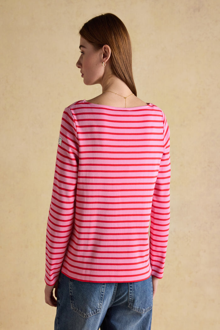 A timeless classic with a fresh pop of colour, the Joules Harbour Breton top in pink and red stripe is one of those pieces that never dates. Shop Joules at Dotique.