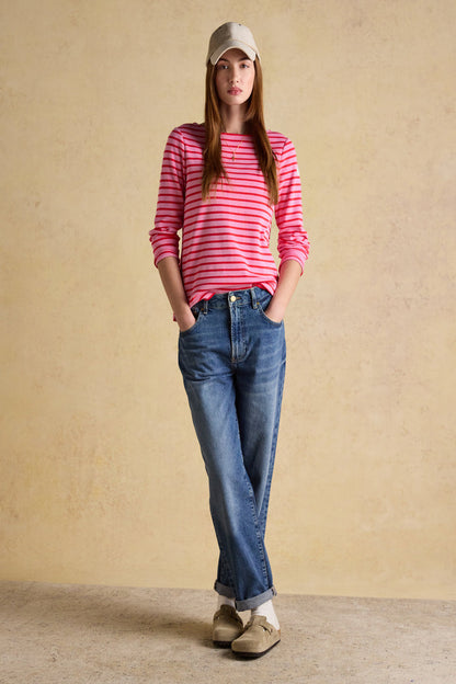 A timeless classic with a fresh pop of colour, the Joules Harbour Breton top in pink and red stripe is one of those pieces that never dates. Shop Joules at Dotique.