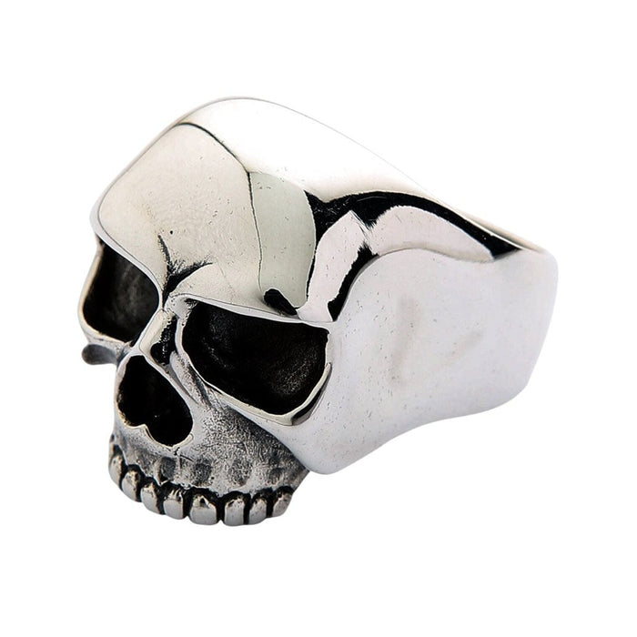 Left side profile showing mirror-polished cranium dome and tapered silver band flowing into the skull design