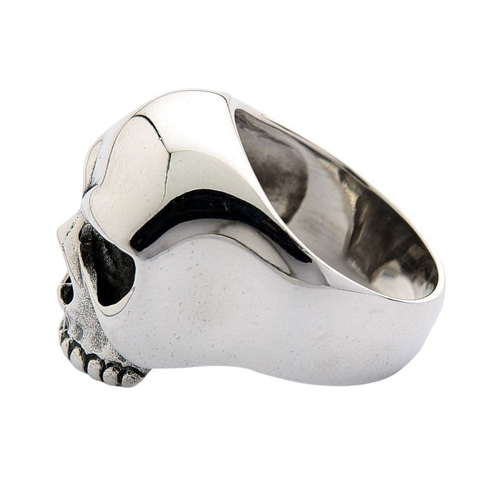 Back angle of the skull ring showing the wide tapered band tapering down from the polished cranium