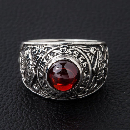 Top view of sterling silver koi fish ring with deep red cabochon centerpiece
