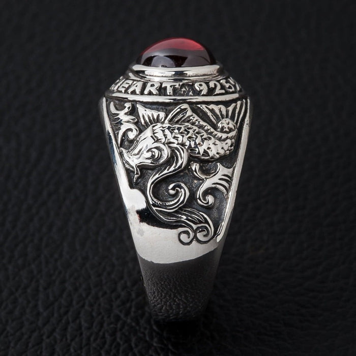 Side profile of Japanese carp ring showing wave pattern and koi fish carving