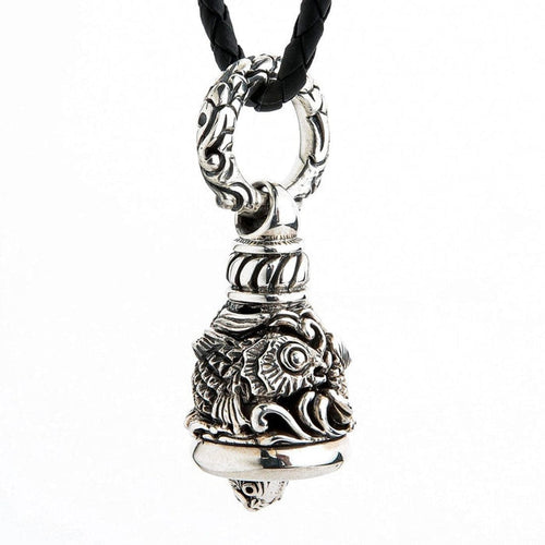 Sterling silver Koi Guardian Bell pendant showing detailed fish scales and face on braided leather cord