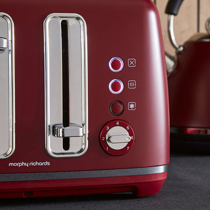 Red toaster with control panel and Morphy Richards branding on a kitchen counter.