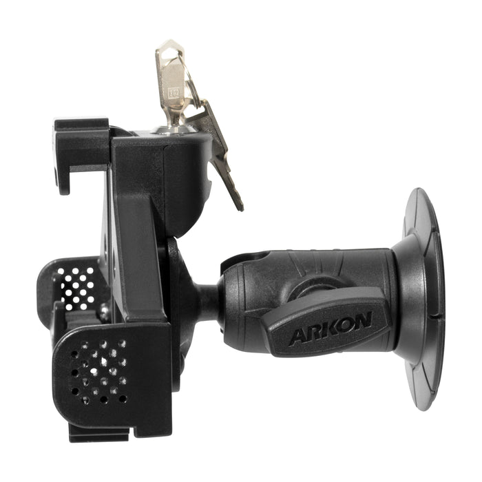 Side view of a black LockVise® Locking Phone Holder with OCTO™ Series Adhesive Mount, featuring an adjustable arm, key lock mechanism with two keys inserted on top.
