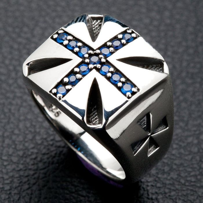 A Knights of Malta-style ring crafted from sterling silver with a brilliant blue stone Maltese cross emblem.