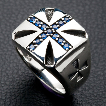 A Knights of Malta-style ring crafted from sterling silver with a brilliant blue stone Maltese cross emblem.