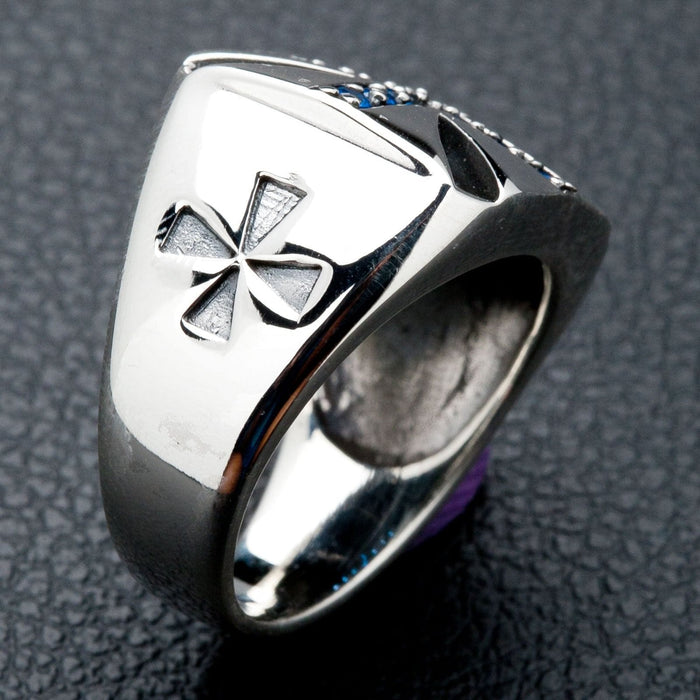 A premium piece of men's biker jewelry: a heavy silver ring with a classic blue stone Maltese cross.