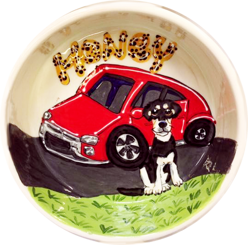 photo of black and white mix breed dog with red car on ceramic dog bowl