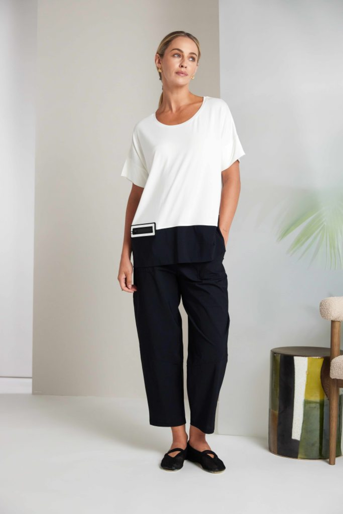Black Naya pull-up trousers with a slim leg, stretch fabric and patch pockets. Comfortable, flattering and easy to wear. Shop now at Dotique.
