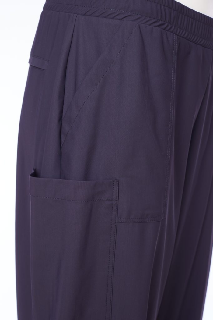 Black Naya pull-up trousers with a slim leg, stretch fabric and patch pockets. Comfortable, flattering and easy to wear. Shop now at Dotique.