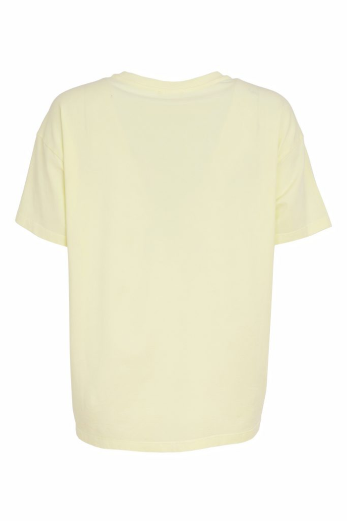 Soft lemon yellow Naya jersey top with a relaxed fit and cut-out hem detail. Easy to wear and perfect for everyday. Shop at Dotique.