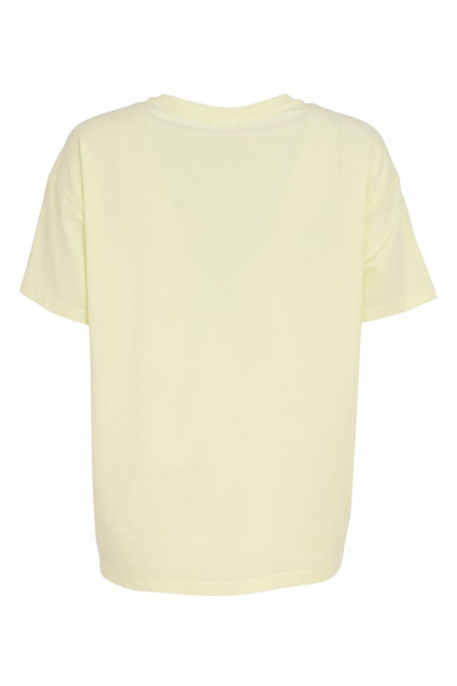 Soft lemon yellow Naya jersey top with a relaxed fit and cut-out hem detail. Easy to wear and perfect for everyday. Shop at Dotique.