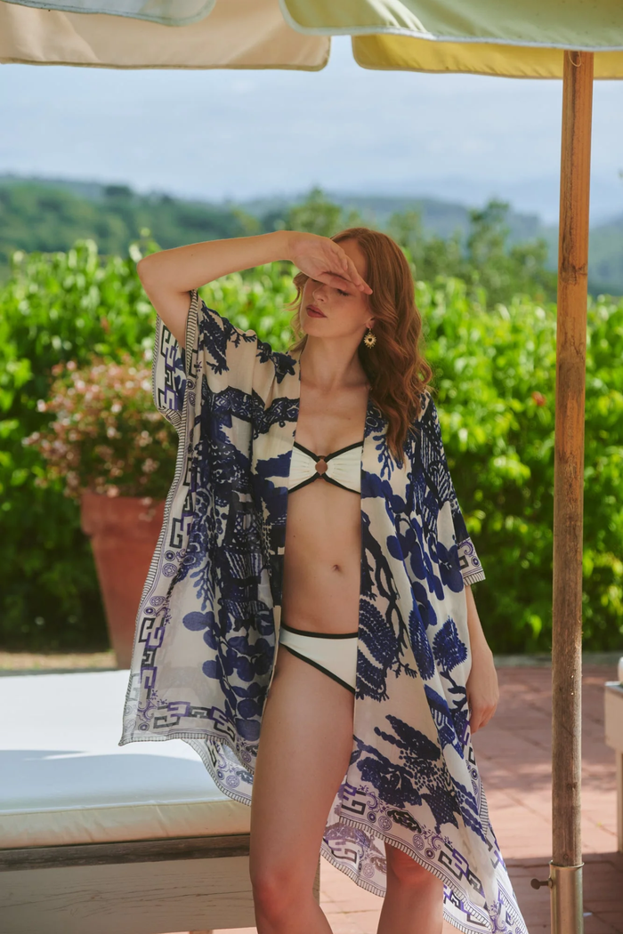 Giant Willow Blue & White throwover by One Hundred Stars in a premium modal-cupro blend. Lightweight, fluid and perfect for layering over dresses or tops. Shop at Dotique.