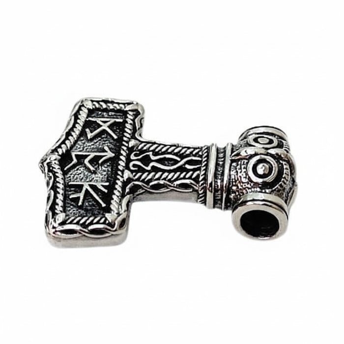 A side profile of the Norse runic Mjolnir pendant, showing its solid silver construction.