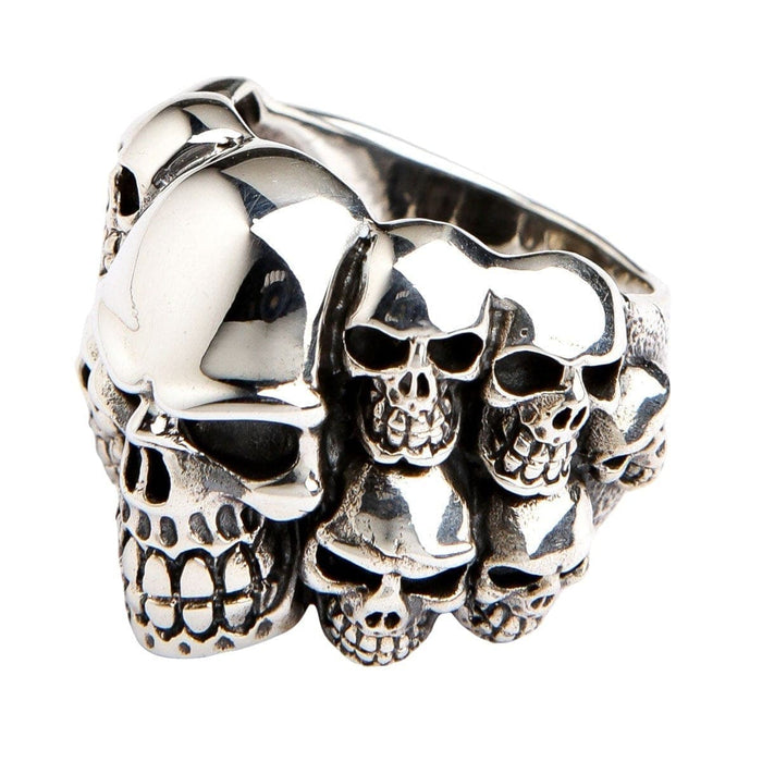 Side profile of the sterling silver multi-skull ring, showing the band of smaller skulls that wrap around the finger.