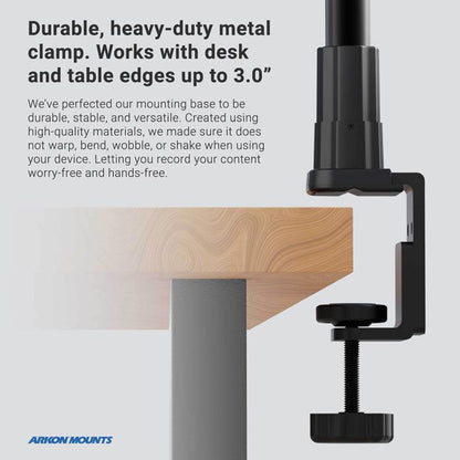 The Remarkable Creator™ Pro Stand with Clamp Base and Teal Extension Pole secures devices to desk corners, attaching to surfaces up to 3 inches thick. Durable and versatile, its sturdy black metal clamp ensures reliable support.