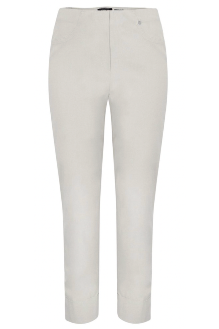 Cream-colored women's tailored stretch trousers with elastic waistband and front pockets on white background