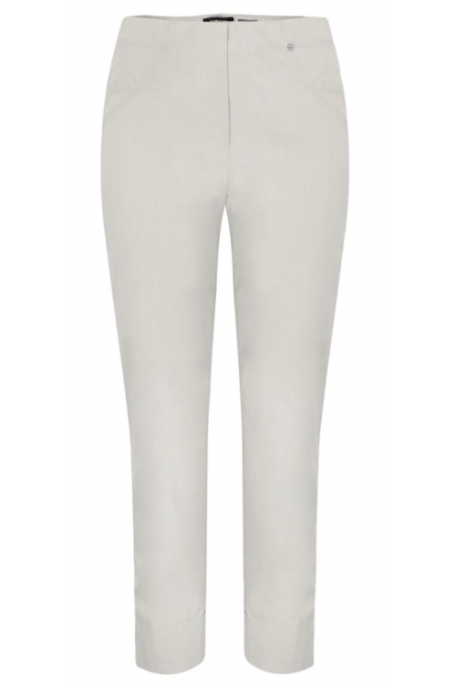 Cream-colored women's tailored stretch trousers with elastic waistband and front pockets on white background
