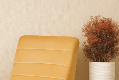 Yellow upholstered rocking chair with padded seat, back, and rounded arms.