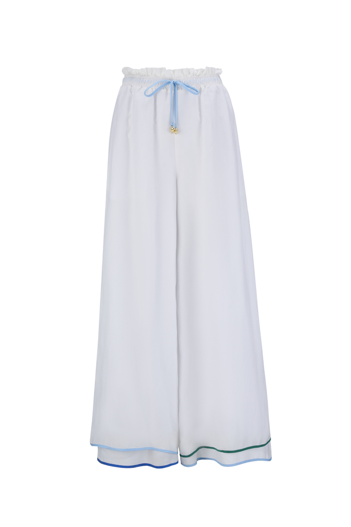 Wide leg cupro trousers by Sancia with elasticated waist and drawstring detail. Lightweight, fluid and easy to style. Shop at Dotique.