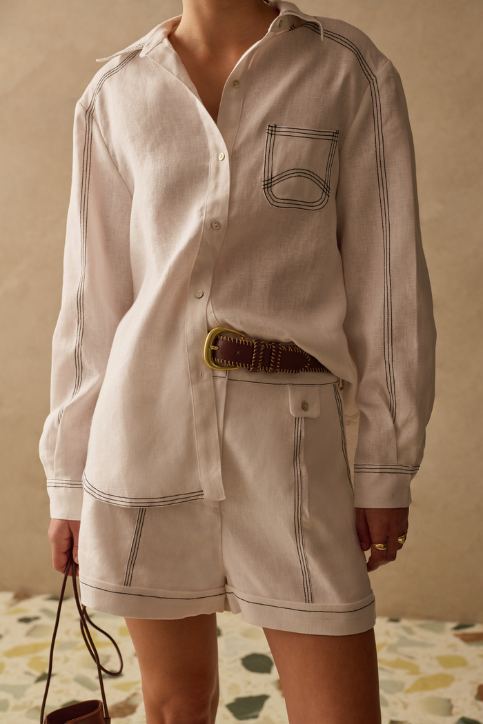 Ivory shirt by Sancia with contrast stitching and a relaxed fit. Lightweight, easy to wear and perfect for everyday styling. Shop now at Dotique.