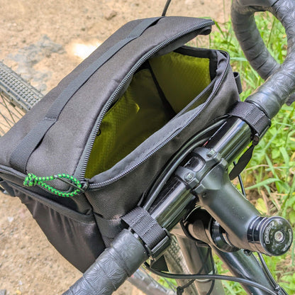 black stashquatch bar bag on bike partially open