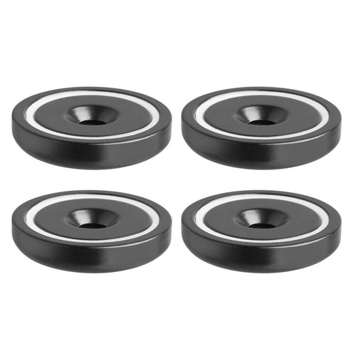 Four SteadyMag™ Magnetic Bases with Hardware, black and round with a white inner ring and central hole, ideal for use with a mounting bracket, are arranged in a 2x2 grid on a white background.