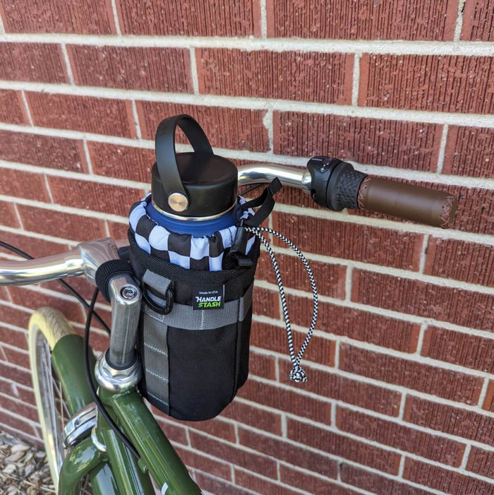 Two Tone and Black stem bag on bicycle handlebars.