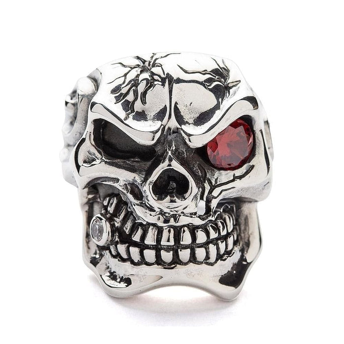 Front view of the heavy sterling silver cracked skull ring showing the red garnet eye and cracked forehead detail.