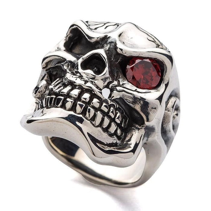 Detailed angle of the cracked skull ring highlighting the clear CZ stone in the tooth.