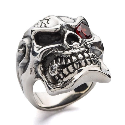 A low-angle shot of the men's garnet skull ring emphasizing its large, intimidating design and CZ tooth.
