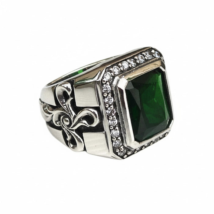 A large emerald CZ ring for men in a sterling silver gothic setting with a brilliant stone halo.