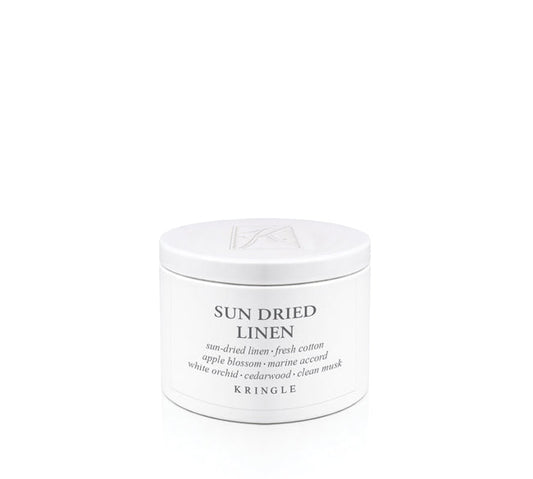 Kringle Candle tin labeled 'Sun Dried Linen' on a white background