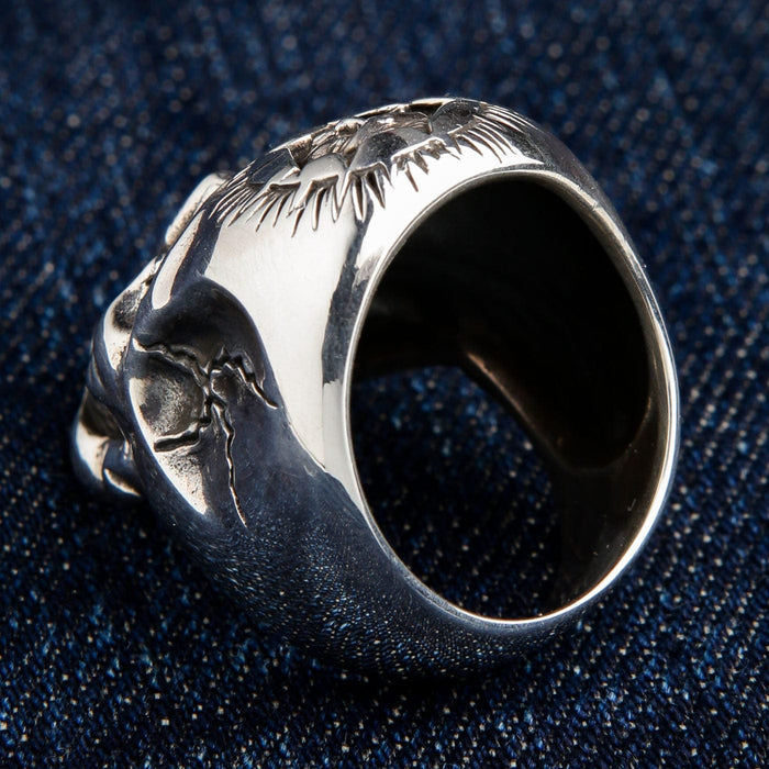 The inside of the large silver skull ring, showing the thick, solid band construction.