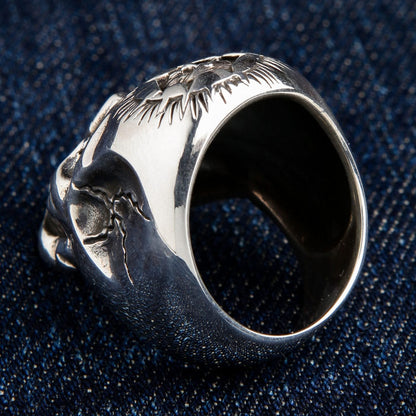 The inside of the large silver skull ring, showing the thick, solid band construction.