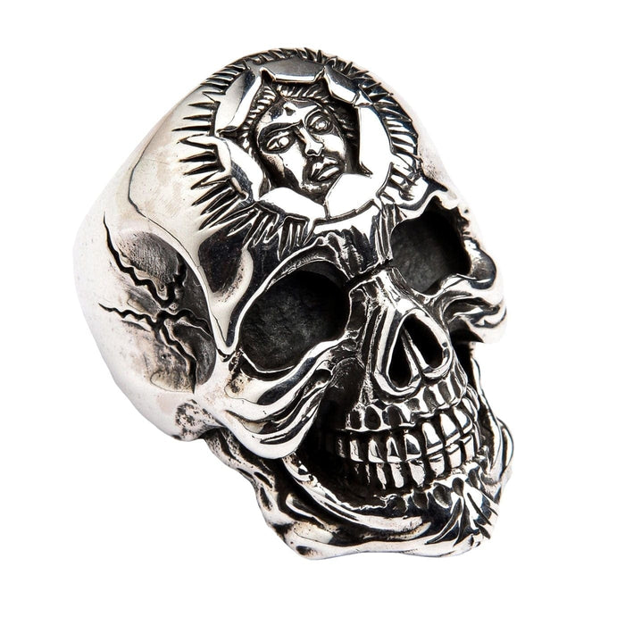 A solid 925 sterling silver sun god skull ring on a white background, showing the detailed skull face and carved sun god.