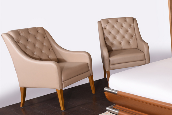 Tufted upholstered accent chair, beige/tan leather-look with wooden legs, pair
