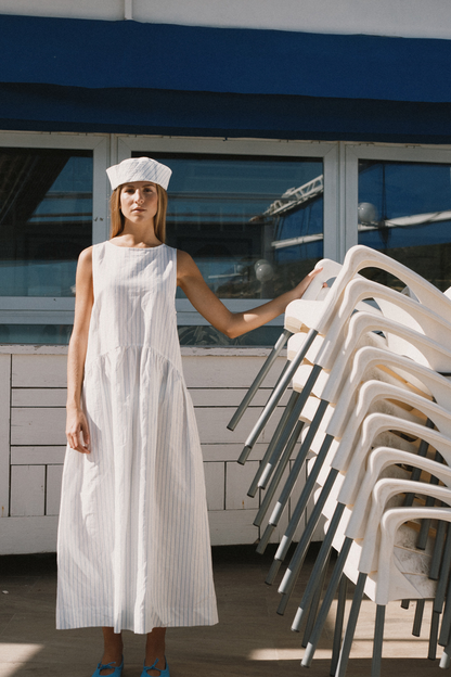 Tiny Big Sister striped cotton dress with a low back detail and relaxed summer fit. Light, flattering and easy to wear. Shop at Dotique.