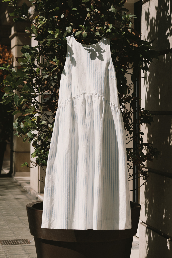 Tiny Big Sister striped cotton dress with a low back detail and relaxed summer fit. Light, flattering and easy to wear. Shop at Dotique.